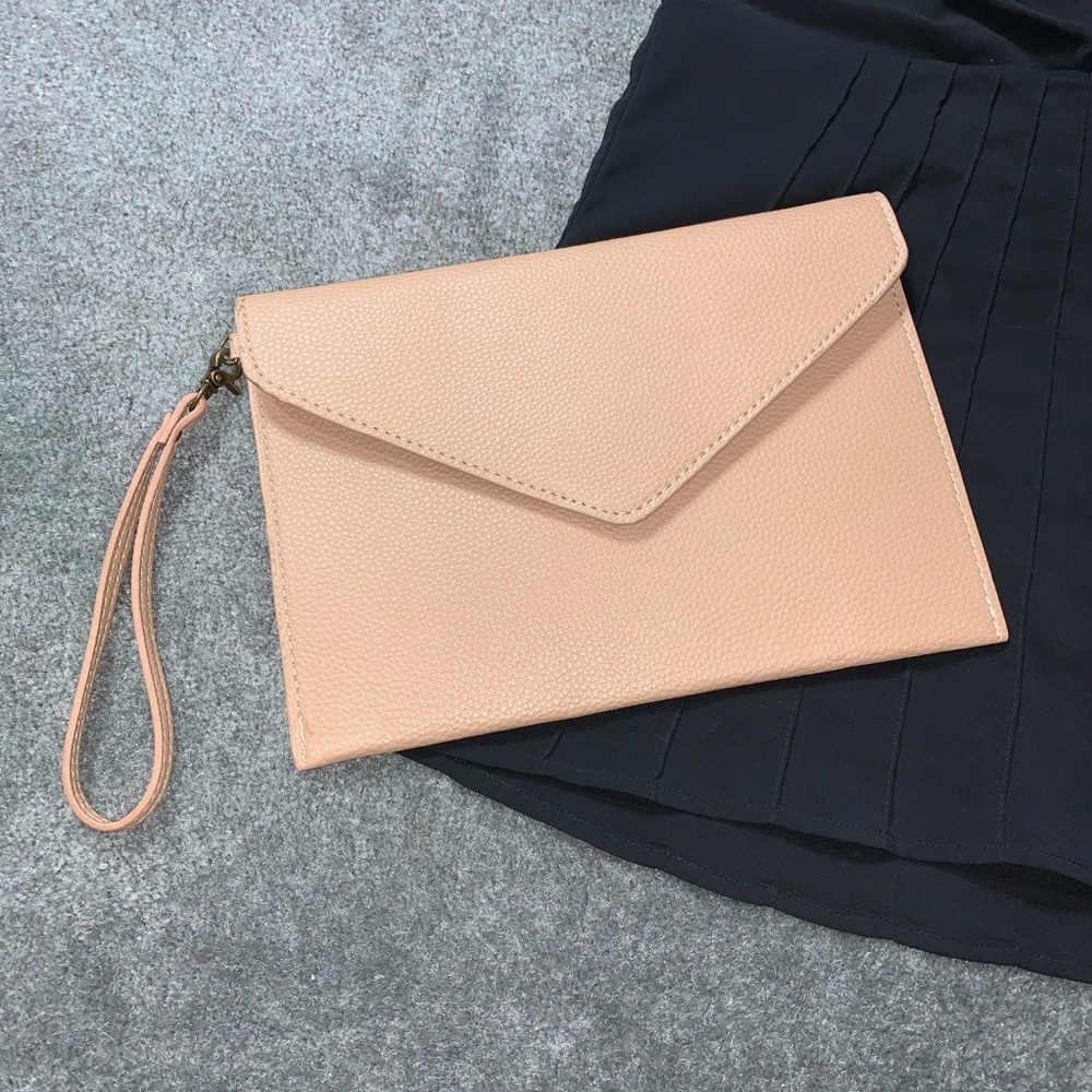 Tan envelope clutch with wrist strap